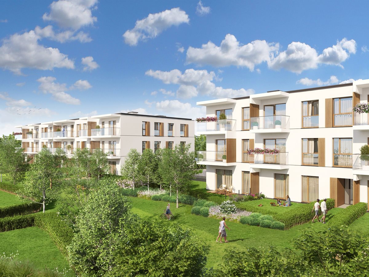 Apartamenty Białej Koniczyny - Widok na budynek i tereny zielone